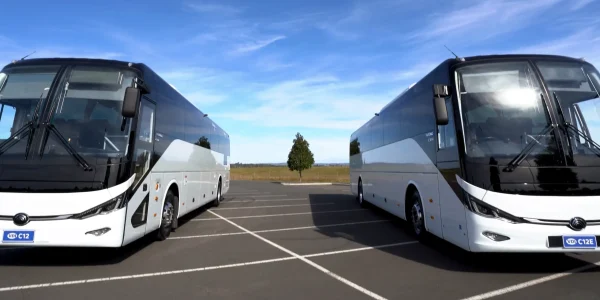 Yutong C12 and Yutong C12E in empty parking lot